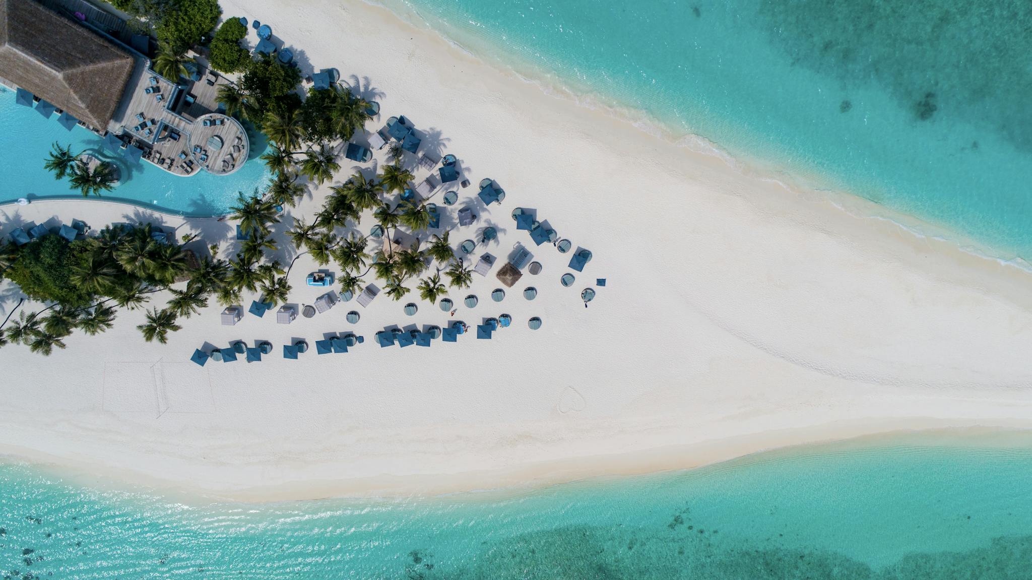 Tropical sandy island with hotel